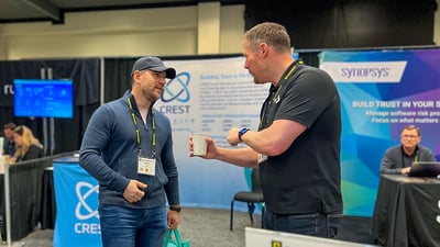BitLyft CEO talks with conference attendee