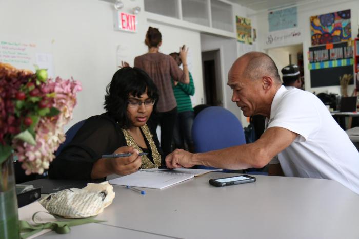 Teacher helping student