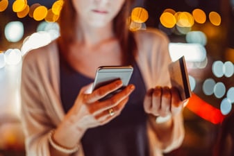 woman-inputting-credit-card-information-on-phone